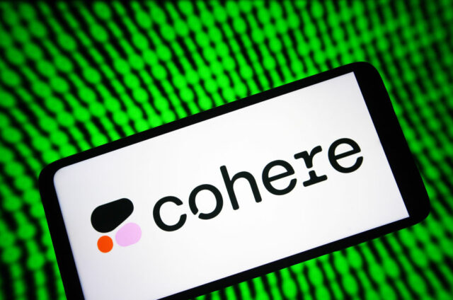 Image of a phone with Cohere's logo on it with a green digital background.