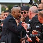 Denzel Washington ficou preso por um fotógrafo entusiasmado quando compareceu na segunda -feira na estréia de Cannes de seu filme mais alto, mais baixo