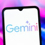 The Google Gemini AI logo is seen displayed on a smartphone screen.