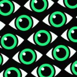 Green eyes with a white glint on a patterned black background.