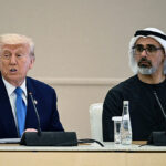 US President Donald Trump (L) speaks as he sits next to Abu Dhabi's Crown Prince Sheikh Khaled bin Mohamed bin Zayed Al Nahyan during the business dialogue forum in Abu Dhabi on May 16, 2025. The United Arab Emirates is the third leg of Trump's visit to the region, which has already taken him to Saudi Arabia and Qatar. (Photo by Brendan SMIALOWSKI / AFP) (Photo by BRENDAN SMIALOWSKI/AFP via Getty Images)