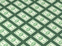 DOJ acusa negociadores de ransomware dos EUA de lançar seus próprios ataques de ransomware an illustration of patterned 100 dollar bills on a green background