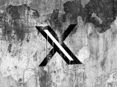 Elon Musk pausa mudanças no programa de participação nos lucros do criador de X após reação negativa X (formerly Twitter) logo on a cracked wall