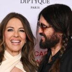 Billy Ray Cyrus e Elizabeth Hurley são amados durante a noite