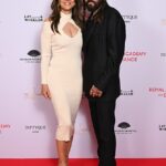 Elizabeth Hurley parecia amada com seu namorado Billy Ray Cyrus quando eles participaram da noite de arrecadação de fundos da Academia Real de Dança na segunda -feira