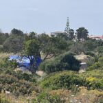A polícia portuguesa à tarde viu estradas próximas de cascalho na área de Atalaia, perto de Praia da Luz, onde a busca de amanhã por pistas sobre o desaparecimento de Madeleine McCann acontecerá principalmente