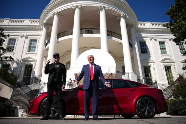 U.S. President Donald Trump and White House Senior Advisor, Tesla and SpaceX CEO Elon Musk deliver remarks next to a Tesla Model S on the South Lawn of the White House on March 11, 2025 in Washington, DC.