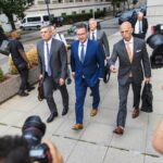 Trevor Milton, founder of Nikola Corp., center, exits court in New York, US