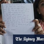 Os advogados de Jazmyn Gourdeas, a esposa mataram o homem de Melbourne, Zivan Radmanovic, seguram -o note à mão para pressionar uma entrevista em Bali na terça -feira.