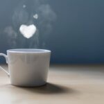 A cup of coffee with a lot of love. Conceptual photography Hearts of smoke come out of a cup of coffee.