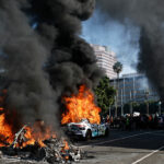 Waymo cars burn during immigration raid protests on June 08, 2025 in Los Angeles, California. Tensions in the city remain high after the Trump administration called in the National Guard against the wishes of city leaders following two days of clashes with police during a series of immigration raids.