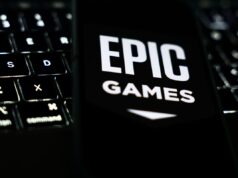 Epic Games corta 1.000 empregos, diz que o envolvimento do Fortnite caiu A laptop keyboard and Epic Games logo displayed on a phone screen are seen in this illustration photo taken in Krakow, Poland on October 1, 2024. (Photo by Jakub Porzycki/NurPhoto via Getty Images)
