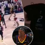 A estrela da WNBA Kahleah Copper's Parga cai do meio do jogo-o fã é jogado atrás da zombaria