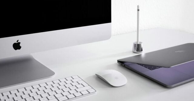 As oito razões pelas quais as pessoas atualizam Mac ou PC, à medida que as remessas aumentam | MacBook e iMac em uma mesa
