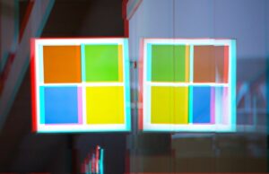 Centenas de organizações violadas por hacks em massa do SharePoint a moshed/glitchy version of a Windows logo on a Microsoft Store front