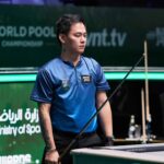 Johann Chua está em ação durante o campeonato mundial da piscina