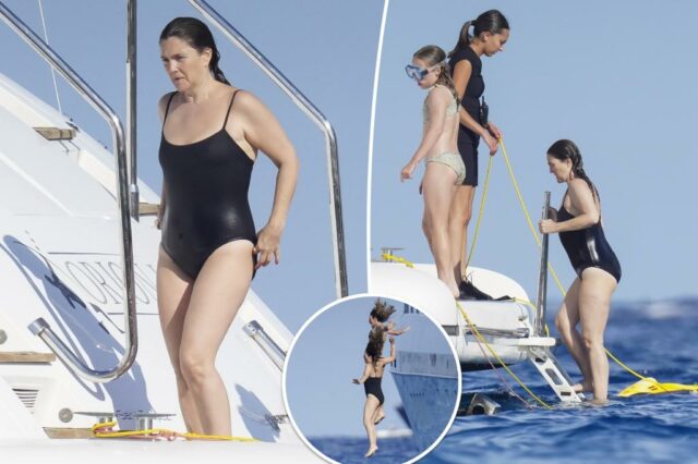 Drew Barrymore mergulha o maiô preto no iate em St. Tropez

