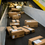 Boxes move along a conveyor belt at the Amazon.com Inc. fulfillment center on Cyber Monday in Robbinsville, New Jersey, U.S., on Monday, Nov. 30, 2015. Online sales on Cyber Monday may rise at least 18 percent from a year earlier, slower growth than during the holiday weekend, as consumers start their Internet shopping earlier, according to forecasts by International Business Machines Corp. Photographer: Michael Nagle/Bloomberg via Getty Images