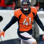 LB Sanders Bronchos ferido, carregado no acampamento