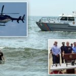 Long Island em alarmes de tubarões altos, porque milhares vão para a praia do quarto julho