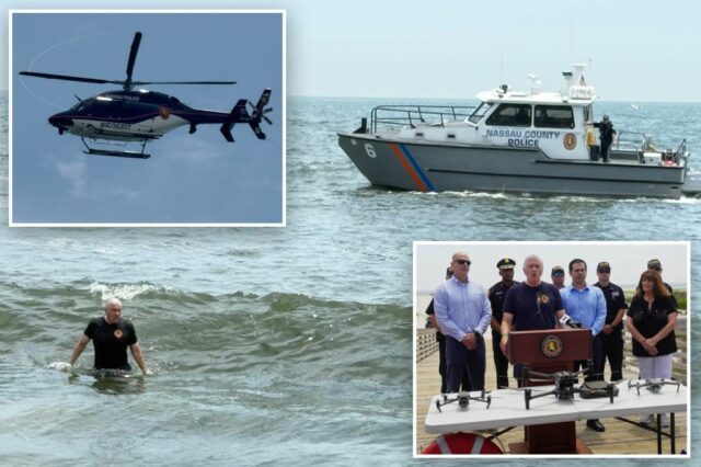 Long Island em alarmes de tubarões altos, porque milhares vão para a praia do quarto julho

