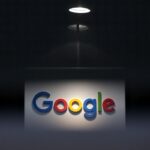 a photo of Google's logo on a dark background