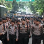 O Tribunal Distrital Central de Yakarta foi cercado, 1.658 a polícia escoltou a decisão de Hastiyanto
