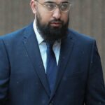 Muhammad Amaad, 26 anos, chegou ao Liverpool Crown Court, onde hoje disse a um júri que estava lutando contra um policial armado porque achava que estava sufocando seu irmão, Mohammed Fahir Amaaz (foto na semana passada)