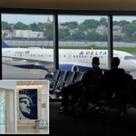 Vista do interior do novo Terminal L Laguardia Aeroporto, contendo uma grande estátua da imagem de Liberty.