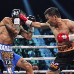 Mario Barrios está lutando contra Manny Pacquiao à esquerda no sábado, 19 de julho de 2025, em uma luta de boxe em Las Vegas.
