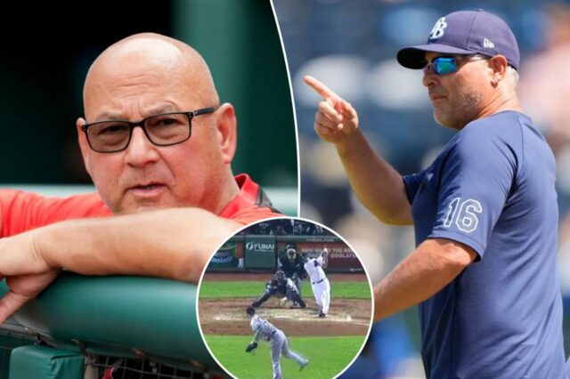 Terry Francon, gerente da Cincinnati Reds, com base no corrimão dos proprietários de terras.