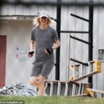 Todos os sorrisos: Elizabeth Holmes piscou um sorriso quando foi visto treinando no sábado no campo de prisão federal Bryan, a menor instalação de segurança Ghislaine Maxwell foi transferida para
