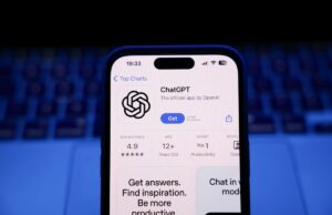 Mais sete famílias estão processando a OpenAI pelo papel do ChatGPT em suicídios e delírios A laptop keyboard and ChatGPT on App Store displayed on a phone screen.