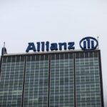 a photo of Allianz's logo at the top of a building.