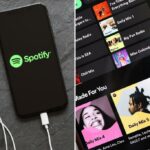 iPhone exibindo o logotipo do Spotify e os holofotes.