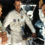 Kevin Bacon, Tom Hanks e Bill Paxton vêem o palco de um filme