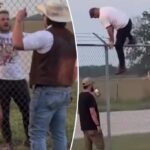 Assista Zach Bryan Scale Fence, lançar 'ameaças de morte' em luta selvagem com o cantor de companheiro de campo: 'Coma um snickers mano'