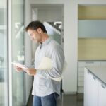 Man sorting mail at home