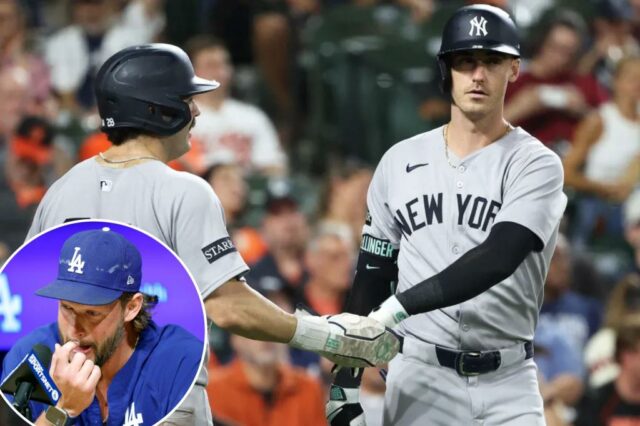 Austin Wells (28) comemora com Cody Bellinger (35) depois de marcar uma corrida durante o sétimo turno da vitória por 7-0 dos Yankees sobre os Orioles em 18 de setembro de 2025.