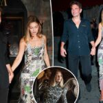 Gigi Hadid segura as mãos com Bradley Cooper enquanto eles celebram sua capa da Vogue em Nova York