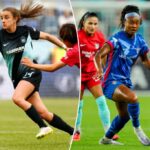 O meio -campista do Gotham FC Nealy Martin (14) disputando a bola contra o meio -campista da Carolina do Norte Shinomi Koyama (20) durante um jogo de futebol da NWSL.
