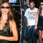 Hailey Bieber atordoa em Little Black Dress enquanto ela acozava Justin na festa de lançamento de 'Swag II'