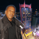 Jay-Z Champions Caesars Palace Times Square Casino como investimento cultural. Shawn “Jay-Z” Carter em pé em frente a uma renderização noturna da torre de cassino da Times Square do Césars Palace, iluminada acima da Times Times Square.