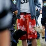 A polícia de NSW enfrenta uma grande lei de compensação após uma decisão sobre uma busca ilegal de tira em um festival.