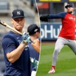 O defensor da direita do New York Yankees, Aaron Judge, segurando um taco de beisebol.