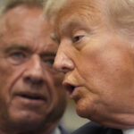 President Donald Trump and Centers for Medicare & Medicaid Services administrator Dr. Mehmet Oz listen as Health and Human Services Secretary Robert F. Kennedy Jr. speaks in the Roosevelt Room of the White House, Monday, Sept. 22, 2025, in Washington. (AP Photo/Mark Schiefelbein)