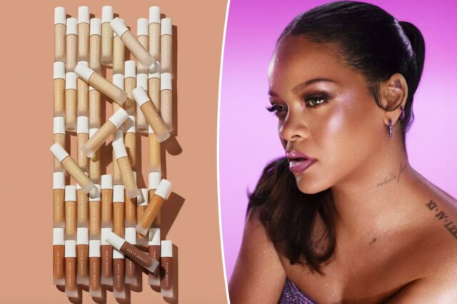 Um frasco de base Fenty Beauty próximo aos braços com vários tons de pele apresentando diferentes tons de base.