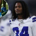 O jogador do Dallas Cowboys, Jaydon Blue, nº 34, em campo antes de um jogo.