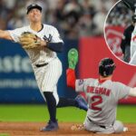 Anthony Volpe faz um arremesso para o primeiro lugar para um jogo duplo, enquanto o Boston Red Sox Alex Bregman desliza durante o oitavo turno da vitória dos Yankees por 4-3 sobre o Red Sox no jogo 2 de sua série de curingas Al.