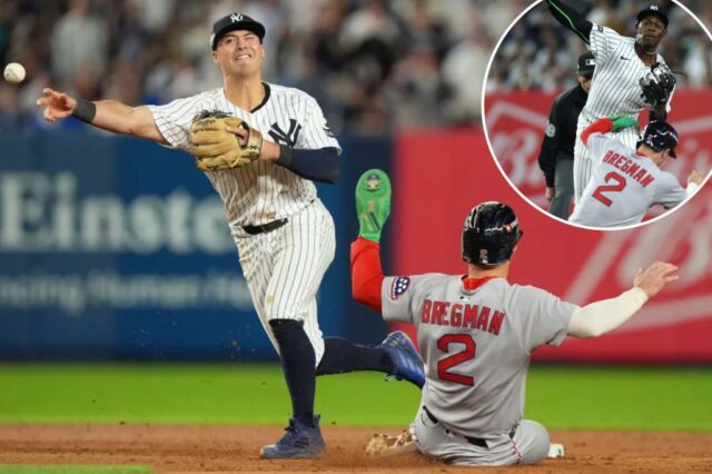 Anthony Volpe faz um arremesso para o primeiro lugar para um jogo duplo, enquanto o Boston Red Sox Alex Bregman desliza durante o oitavo turno da vitória dos Yankees por 4-3 sobre o Red Sox no jogo 2 de sua série de curingas Al.